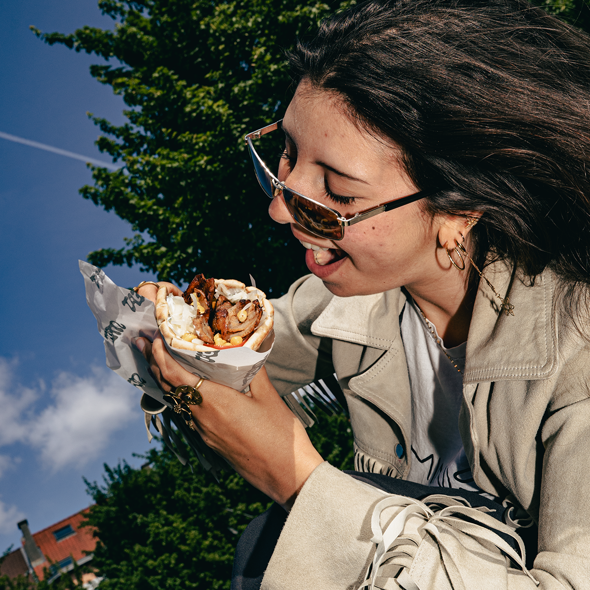 Brown haired girl eating Street food pita Brussels