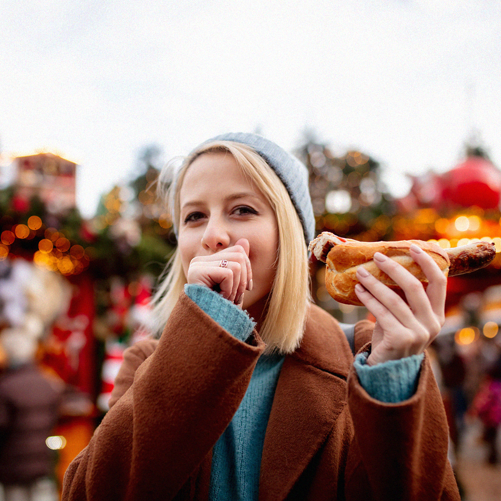 Streat Xmas woman sausage market winter